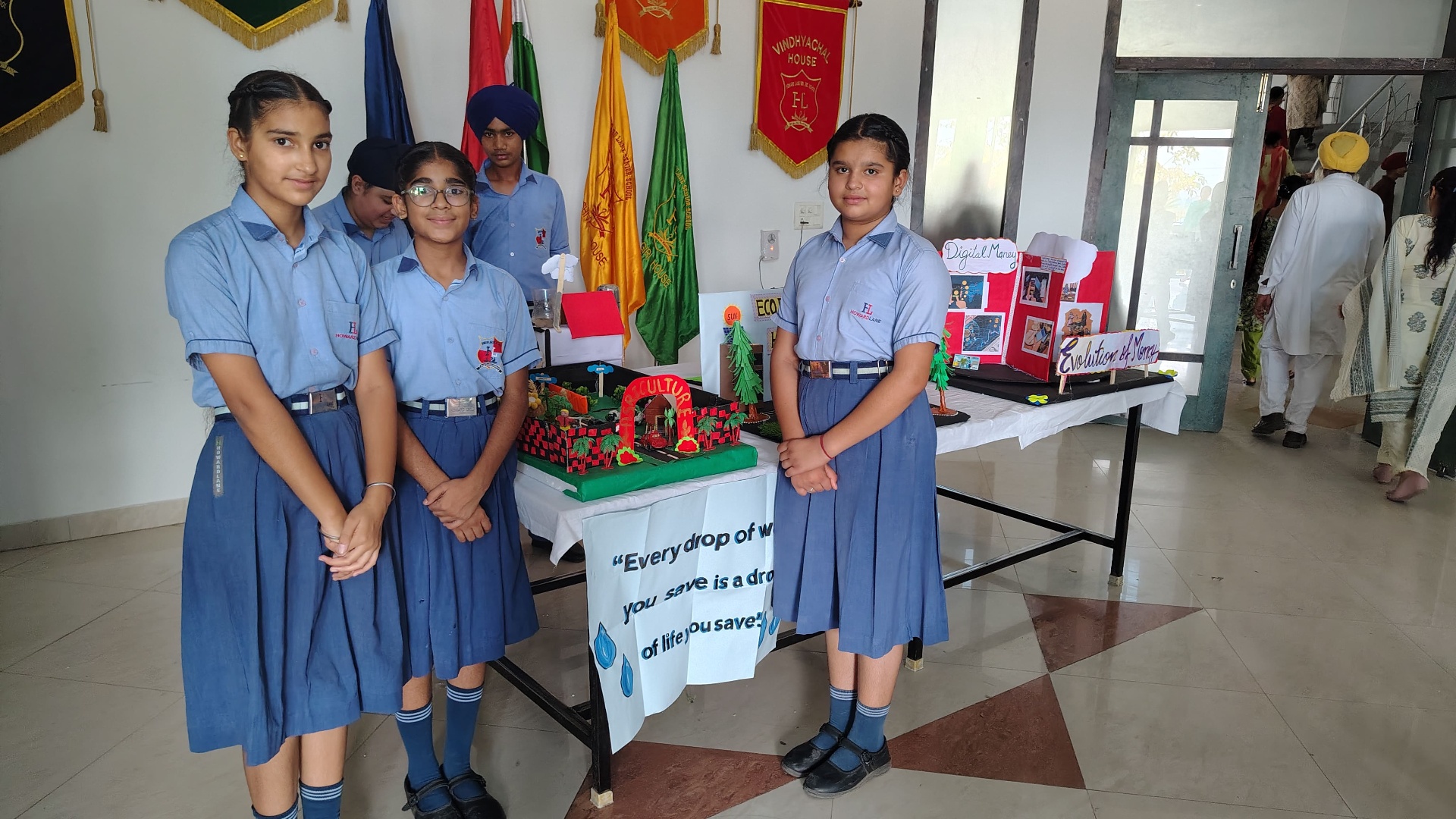 Students presenting models at the annual school exhibition