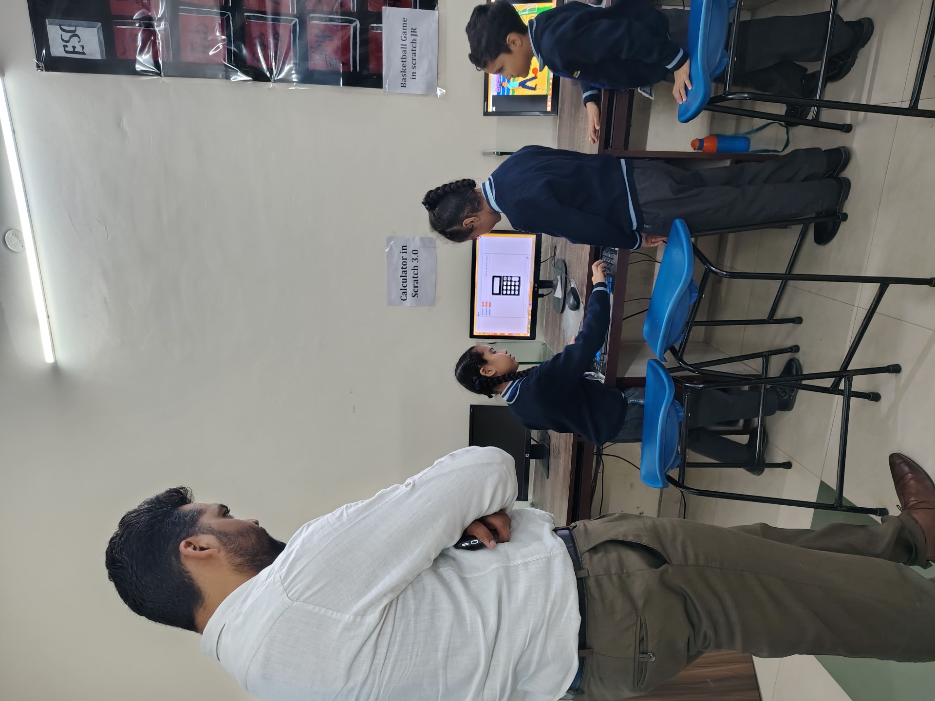 Junior students coding a calculator in Scratch 3.0
